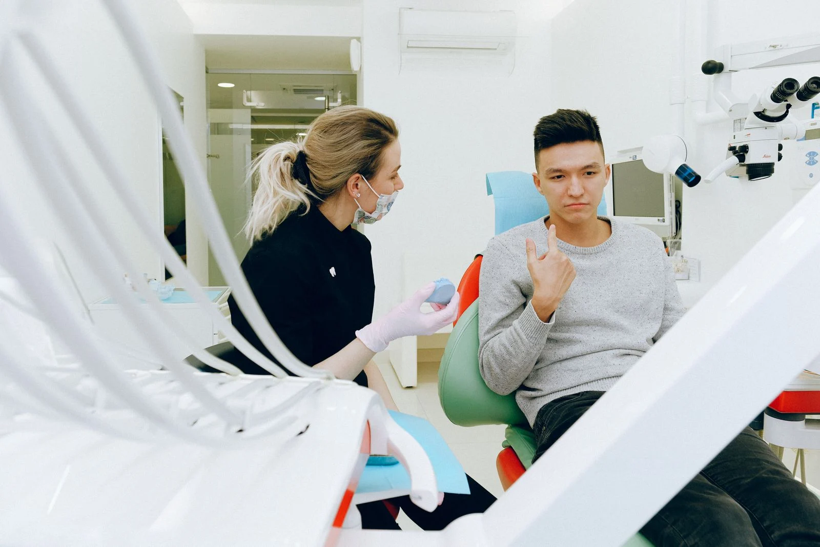 Smiling patient chatting with her dentist during a relaxed check-up