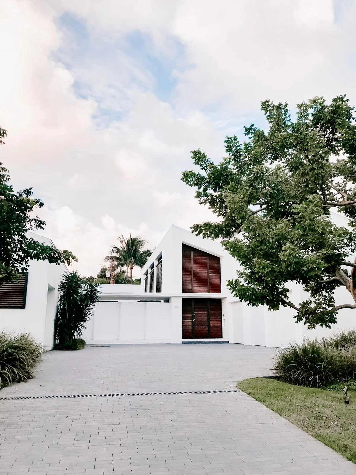 Minimalist home with landscaped garden and driveway